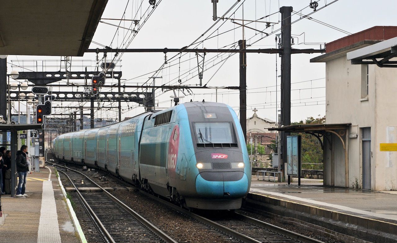 TGV Duplex sets 760 / 762 wearing OUIGO branding arrive at Nimes. 29 Apr 2013.