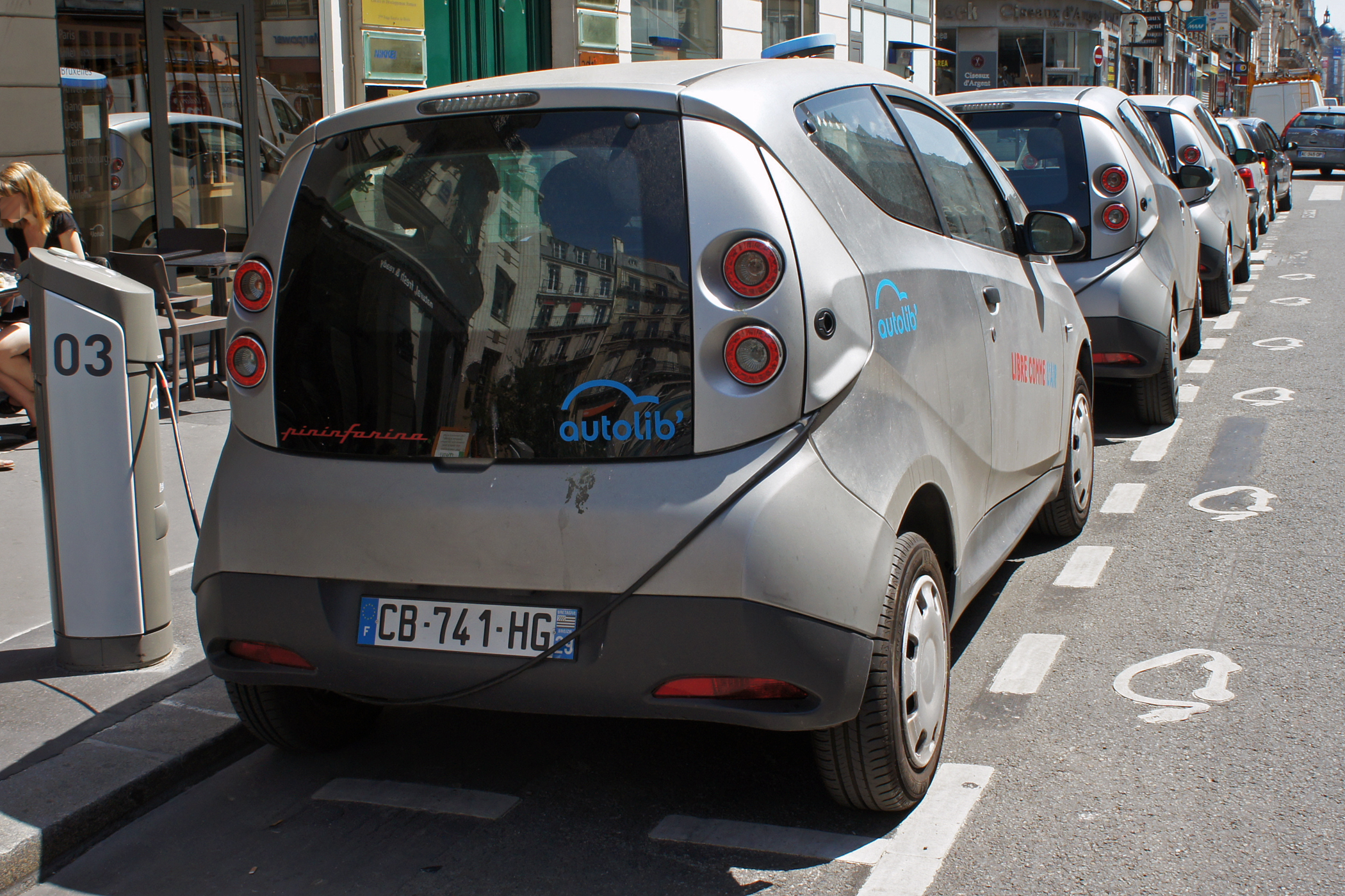 Bolloré Bluecars recharging at an Autolib' carsharing service kiosk on Rue du Quatre Septembre in Paris. 
Date 2 June 2012